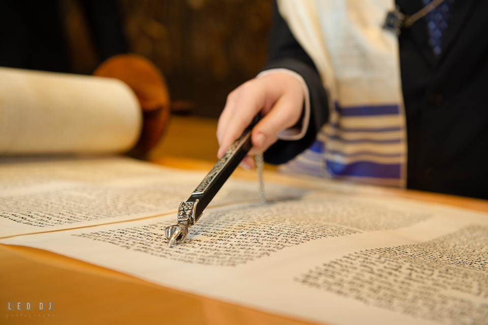 Temple Beth Shalom Annpolis Maryland bar mitzvah boy using yad or Torah pointer to read the parchment Torah scrolls photo by Leo Dj Photography.