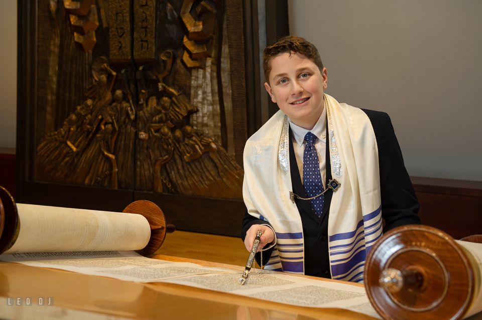 Temple Beth Shalom Annpolis Maryland bar mitzvah boy posing while reading Torah photo by Leo Dj Photography.