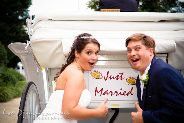 happy bride groom showing just married sign on carriage annapolis kent island maryland wedding photography photographers