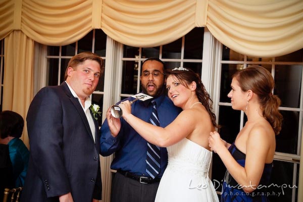 Bride groom doing funny pose with guest. Kent Manor Inn Wedding Photography Kent Island MD Photographer