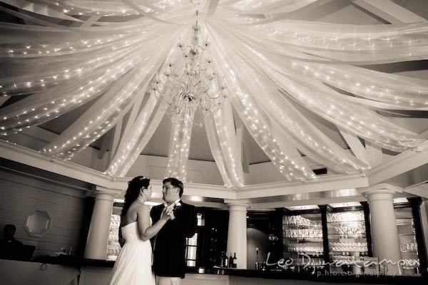 Groom bride first dance under chandelier string lights. Kent Manor Inn Wedding Photography Kent Island MD Photographer