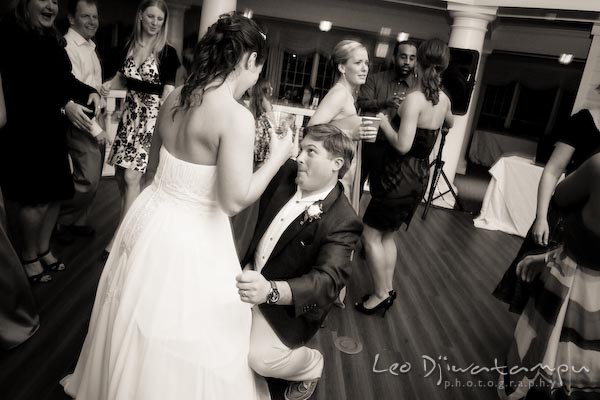 groom getting down, dance with bride. Kent Manor Inn Wedding Photography Kent Island MD Photographer