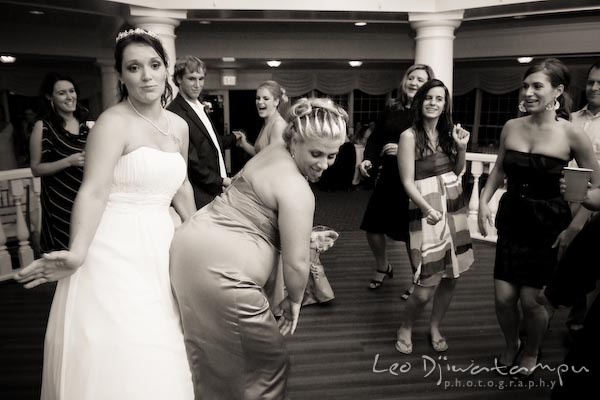 bride slap bridesmaid butt on dance floor. Kent Manor Inn Wedding Photography Kent Island MD Photographer