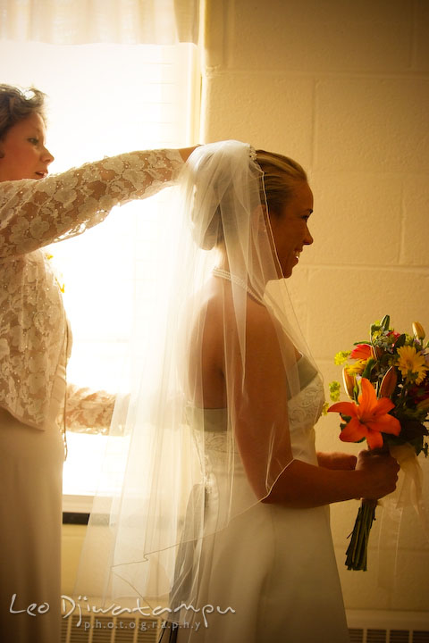 Mother of bride putting on veil for her daughter. Kent Island Methodist Church KIUMC Wedding Photographer Maryland