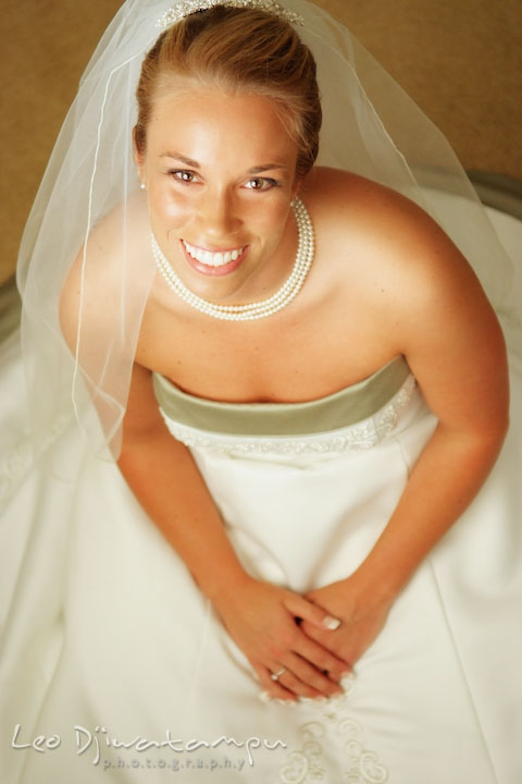 Beautiful bride on her wedding dress, looking up, smiling. Kent Island Methodist Church KIUMC Wedding Photographer Maryland