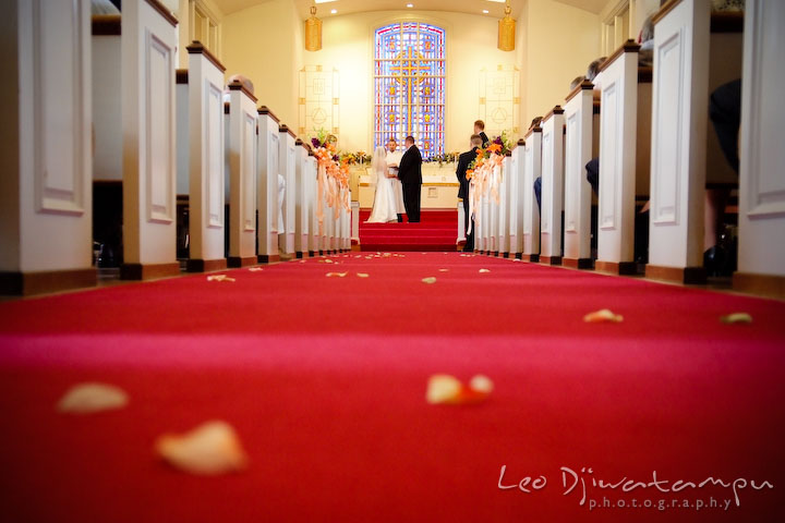 Church isle with flower petals on the carpet. Kent Island Methodist Church KIUMC Wedding Photographer Maryland