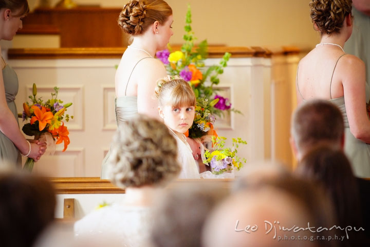 Flower girl, with bridesmaids on the background. Kent Island Methodist Church KIUMC Wedding Photographer Maryland