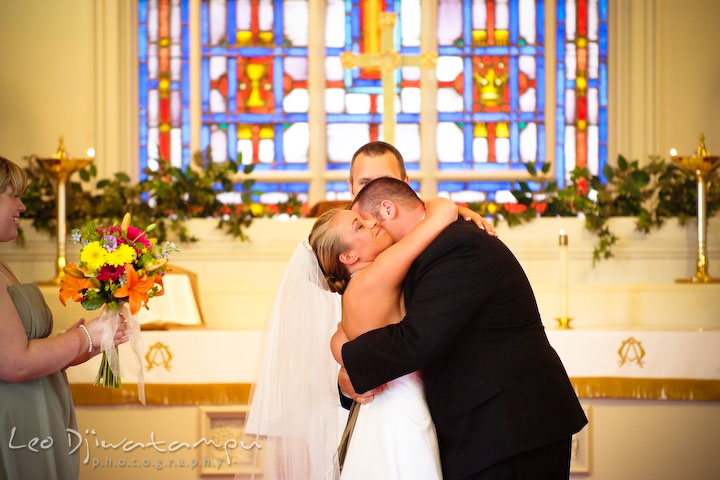 Groom hugging bride after they are official. Kent Island Methodist Church KIUMC Wedding Photographer Maryland