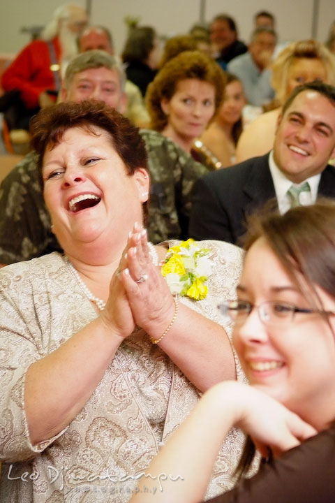 Mother of groom and other guests listening to best man's speech, laughing. Kent Island Flowers MD American Legion Wedding Photographer