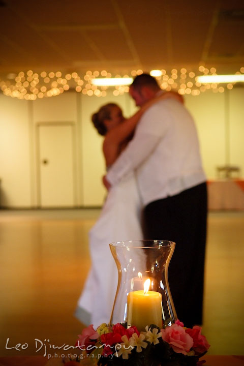 Bride and groom's first dance. Candle in the foreground. Kent Island Flowers MD American Legion Wedding Photographer