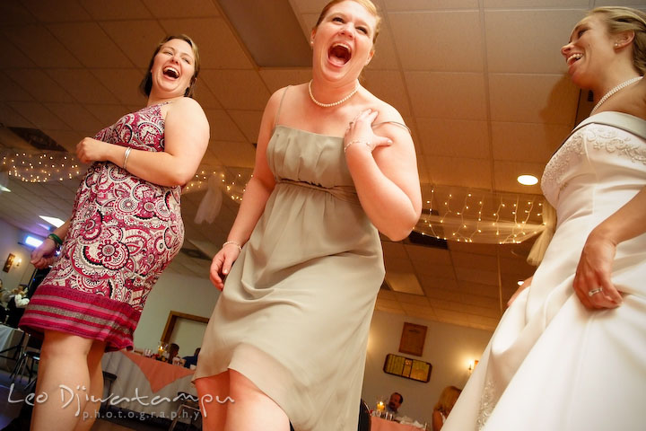 Bridesmaid, bride and guests, dancing and laughing. Kent Island Flowers MD American Legion Wedding Photographer