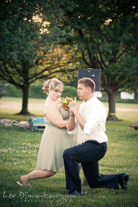 Maid of honor and best man doing holding gun pose. Kent Island Flowers MD American Legion Wedding Photographer