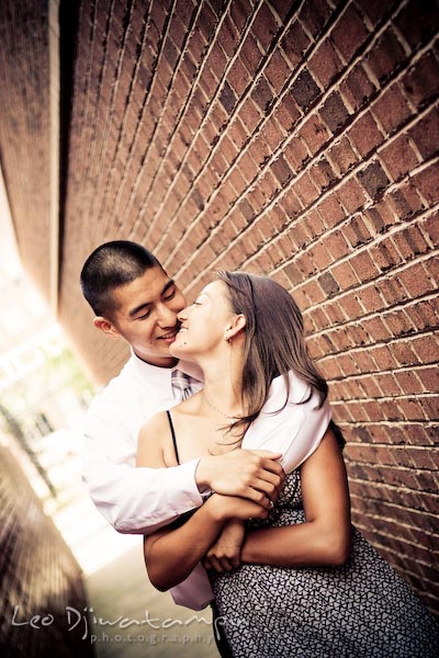 fiancee couple in the alley. fun candid engagement prewedding photo session Old Town Alexandria VA Washington DC