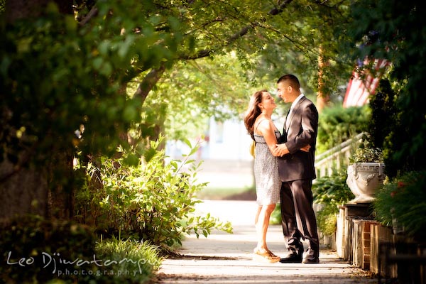 fiancee couple under the sidewalk trees. fun candid engagement prewedding photo session Old Town Alexandria VA Washington DC