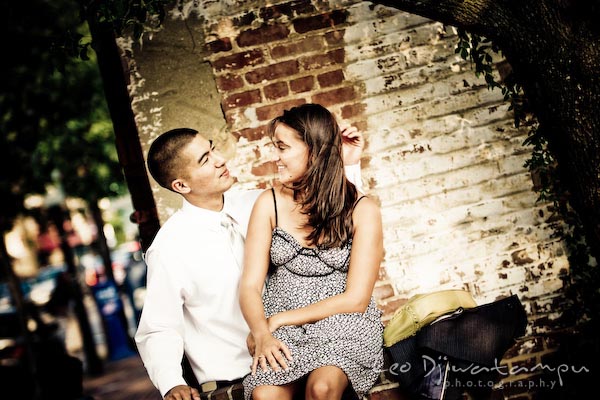 fiancee couple brushing hair. fun candid engagement prewedding photo session Old Town Alexandria VA Washington DC