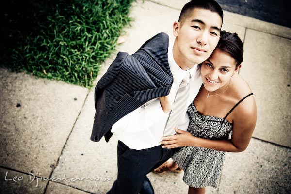 fiancee couple on sidewalk, looking up. fun candid engagement prewedding photo session Old Town Alexandria VA Washington DC