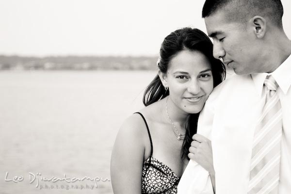 fiancee couple by the harbor dock. fun candid engagement prewedding photo session Old Town Alexandria VA Washington DC