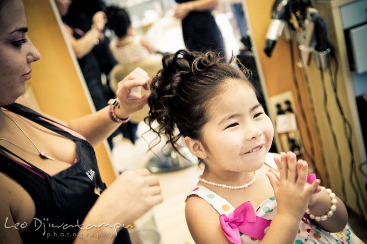 Flower girl enjoys getting her hair done. Stafford Virginia Wedding Photographer