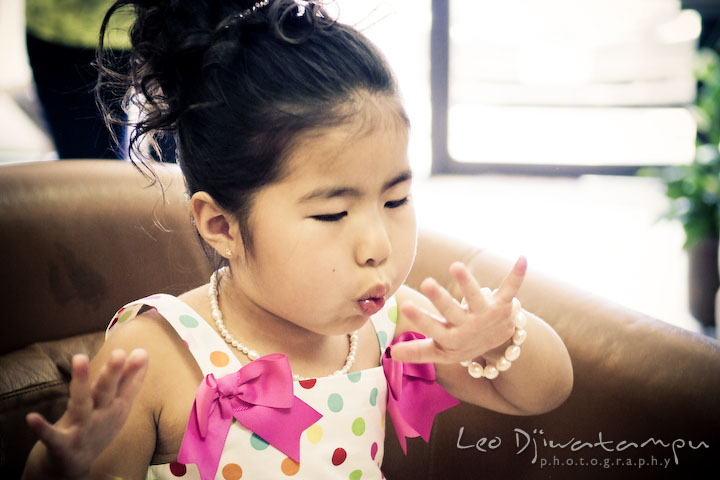 Flower girl drying out her nail polish. Stafford Virginia Wedding Photographer