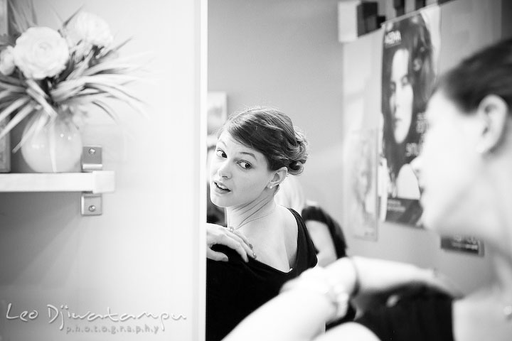 Girl checking out her back in front of the mirror. Stafford Virginia Wedding Photographer