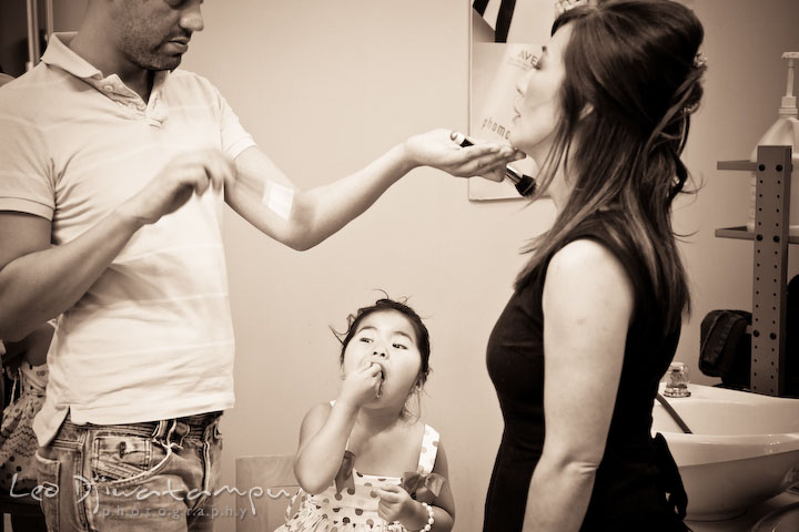Flower girl eating snack while mother gets some make up. Stafford Virginia Wedding Photographer