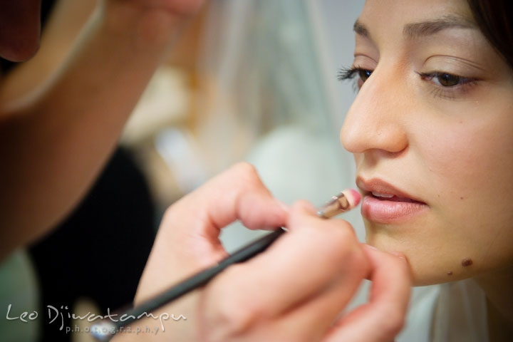 Make up artist applying lipstick on bride. Stafford Virginia Wedding Photographer