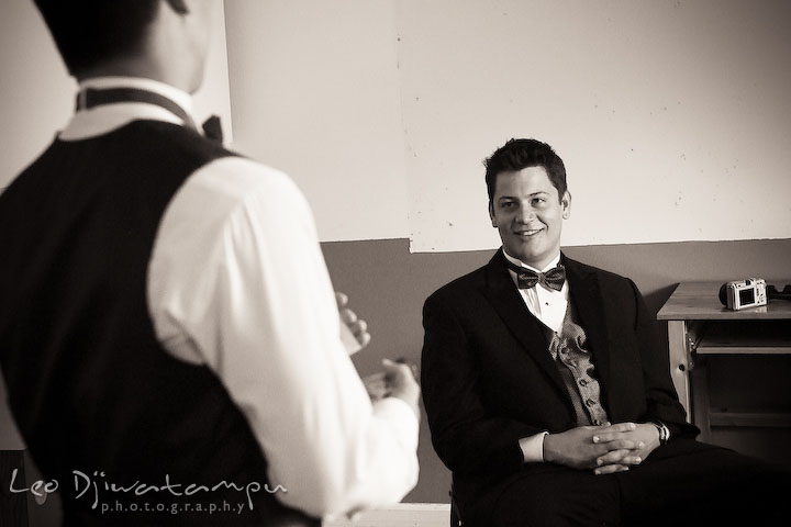 Groomsman listening to best man's speech practice. Stafford Virginia Wedding Photographer