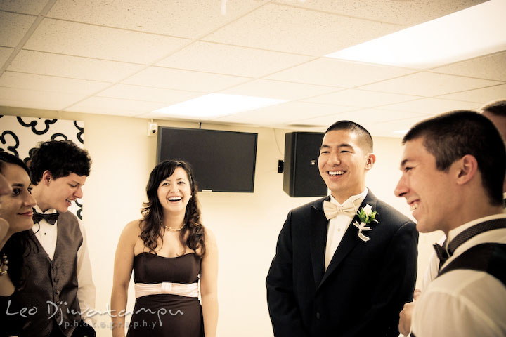 Groom, best man, maid of honor, bridesmaids and groomsmen talking and laughing. Stafford Virginia Wedding Photographer