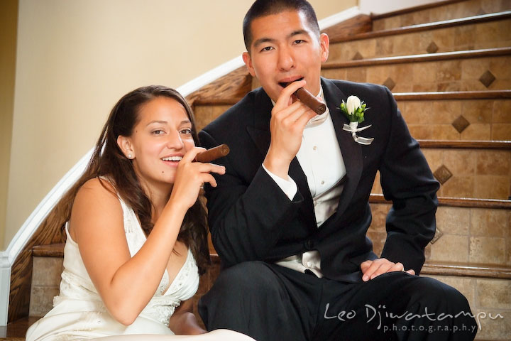 Bride and groom holding cigars. Fredericksburg Square Wedding, Fredericksburg Virginia Wedding Photographer