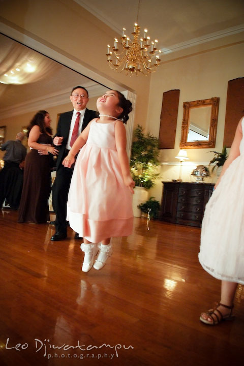 Flower girl jumping while dancing. Fredericksburg Square Wedding, Fredericksburg Virginia Wedding Photographer