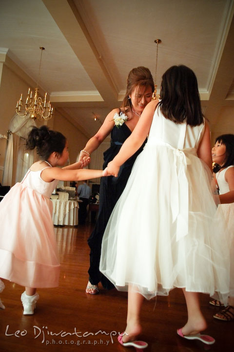 Mother of groom dancing with flower girl and two other girls. Fredericksburg Square Wedding, Fredericksburg Virginia Wedding Photographer