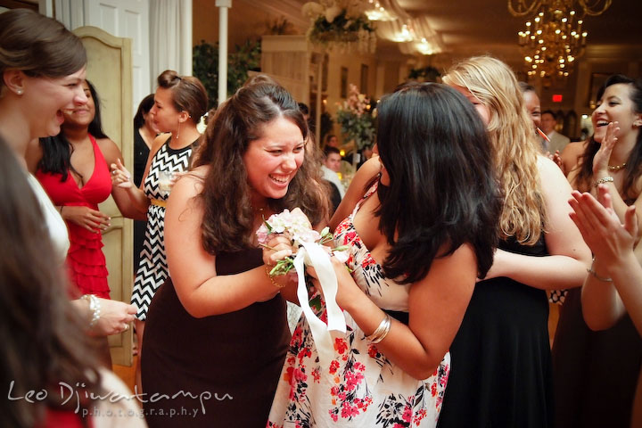 Two girls fighting over the bouquet from the toss. Fredericksburg Square Wedding, Fredericksburg Virginia Wedding Photographer