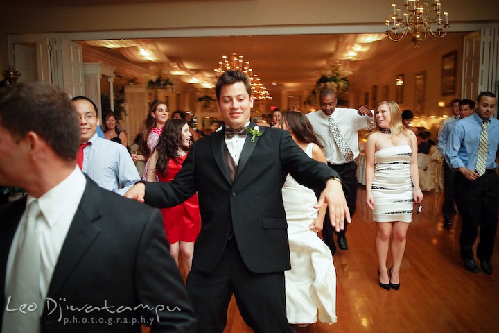 Groomsman and other guests dancing to the Cha Cha Slide song. Fredericksburg Square Wedding, Fredericksburg Virginia Wedding Photographer