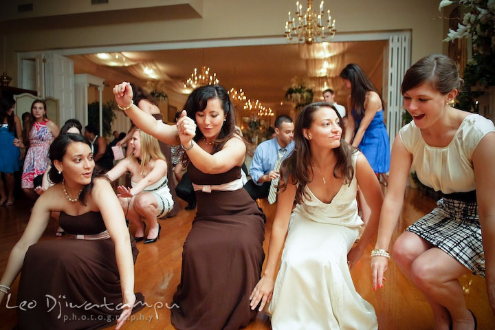 Bride, maid of honor and bridesmaids dancing to the Cha Cha Slide song. Fredericksburg Square Wedding, Fredericksburg Virginia Wedding Photographer