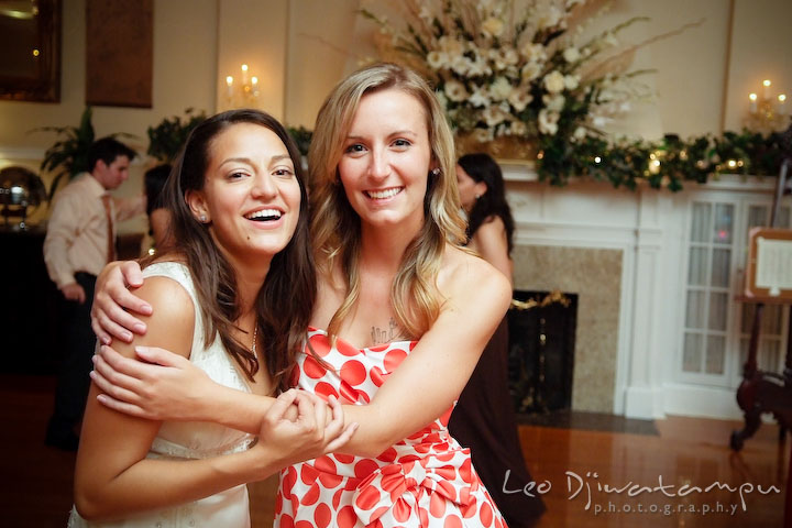 Bride posing and laughing with her friend. Fredericksburg Square Wedding, Fredericksburg Virginia Wedding Photographer
