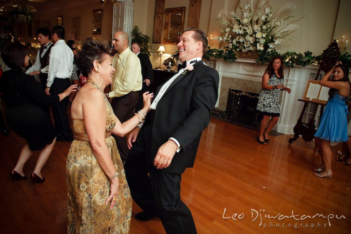 Mother and father of the bride dancing and having fun, laughing. Fredericksburg Square Wedding, Fredericksburg Virginia Wedding Photographer