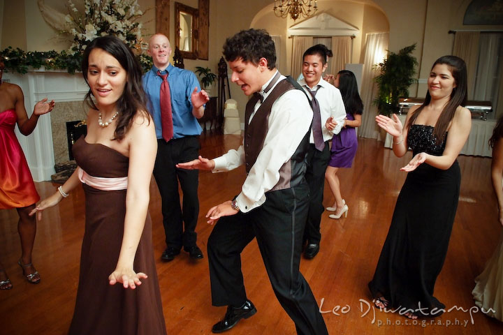 Maid of honor, groomsman and other guests enjoying the music and dancing. Fredericksburg Square Wedding, Fredericksburg Virginia Wedding Photographer