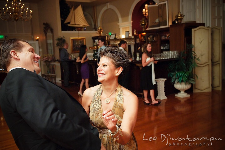 Mother and father of the bride laughing and enjoying the music. Fredericksburg Square Wedding, Fredericksburg Virginia Wedding Photographer