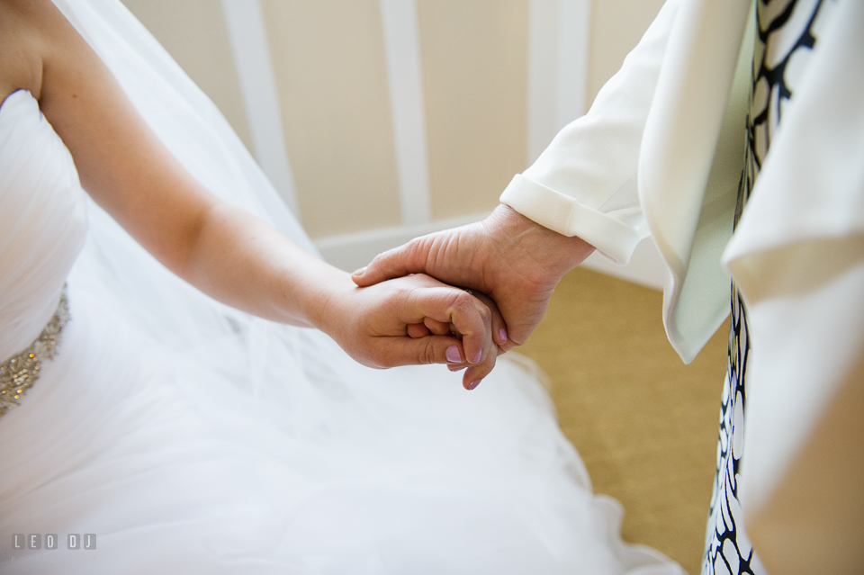 Chesapeake Bay Beach Club Mother of the Bride holding her daughter's hand photo by Leo Dj Photography