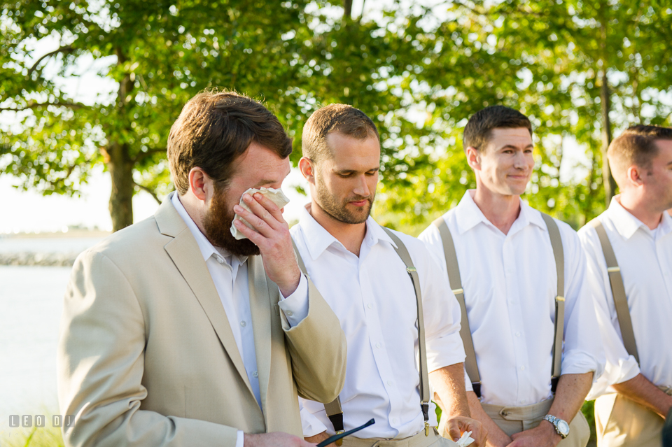 Chesapeake Bay Beach Club Groom crying seeing Bride for the first time during processional photo by Leo Dj Photography