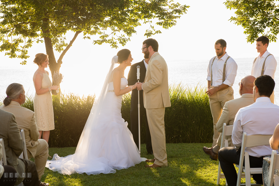 Eastern Shore Maryland Bride and Groom laughing reciting the vow during ceremony photo by Leo Dj Photography