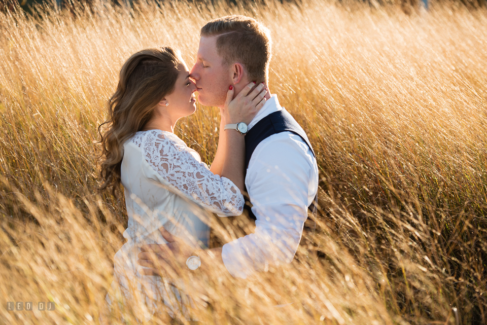 Cape Henlopen Lewes Delaware engaged couple kissing photo by Leo Dj Photography.