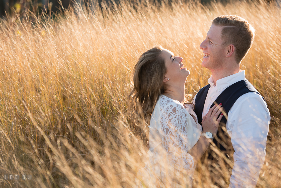 Cape Henlopen Lewes Delaware engaged man laughing with his fiancee photo by Leo Dj Photography.