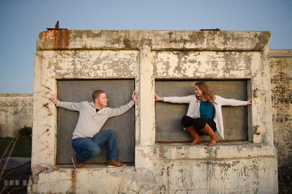 Cape Henlopen State Park Delaware engaged man and his fiancee at abandoned building during engagement photo by Leo Dj Photography.