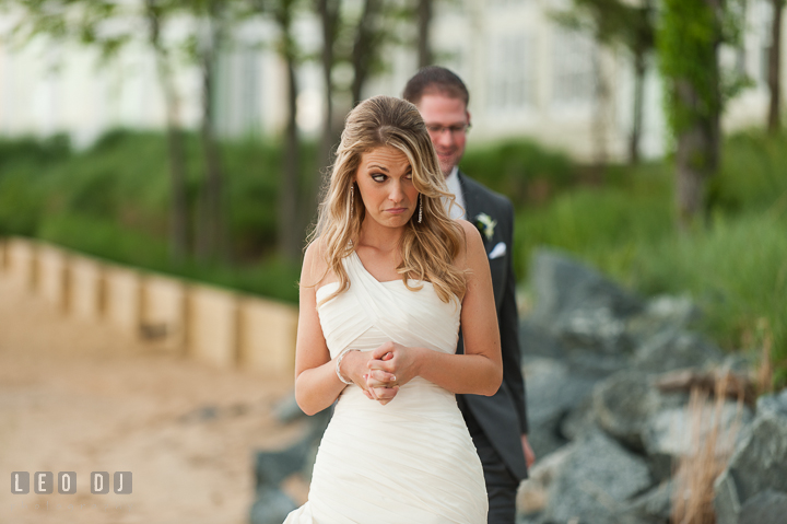 Bride could sense that Groom was coming during first glance. Kent Island Maryland Chesapeake Bay Beach Club wedding ceremony and getting ready photo, by wedding photographers of Leo Dj Photography. http://leodjphoto.com