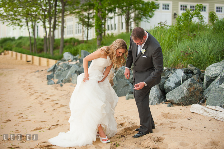 Bride showing her wedding sandals to Groom. Kent Island Maryland Chesapeake Bay Beach Club wedding ceremony and getting ready photo, by wedding photographers of Leo Dj Photography. http://leodjphoto.com