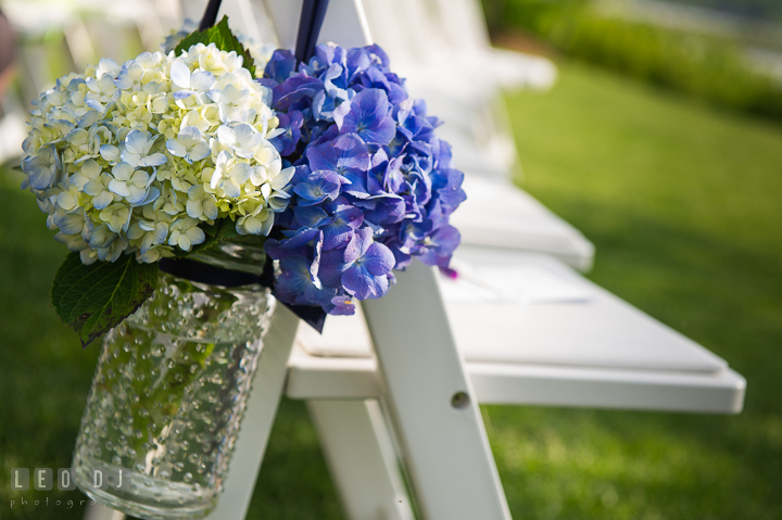 Hydrangeas in glass jars for aisle decorations. Kent Island Maryland Chesapeake Bay Beach Club wedding ceremony and getting ready photo, by wedding photographers of Leo Dj Photography. http://leodjphoto.com