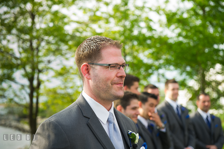 Groom watching Bride walking down the isle. Kent Island Maryland Chesapeake Bay Beach Club wedding ceremony and getting ready photo, by wedding photographers of Leo Dj Photography. http://leodjphoto.com