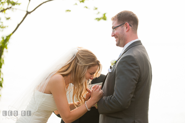Bride couldn't stop laughing becase of what Groom said. Kent Island Maryland Chesapeake Bay Beach Club wedding ceremony and getting ready photo, by wedding photographers of Leo Dj Photography. http://leodjphoto.com