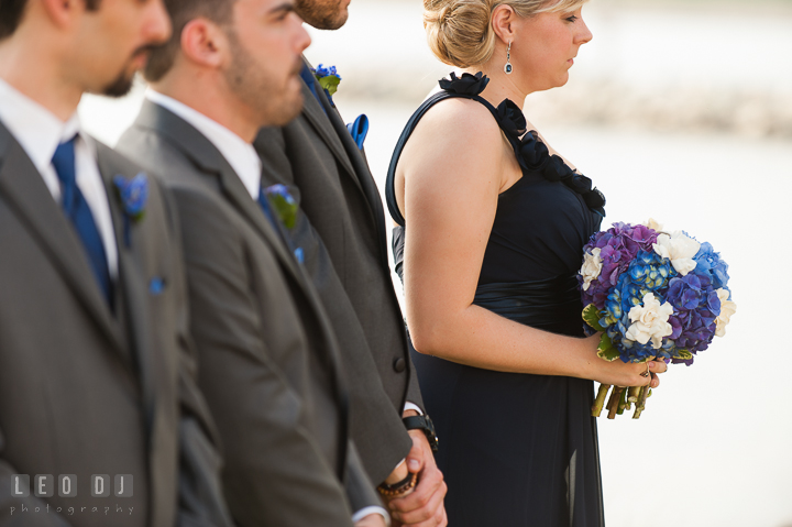 Maid of Honor holding her and Bride's floral bouquets. Kent Island Maryland Chesapeake Bay Beach Club wedding ceremony and getting ready photo, by wedding photographers of Leo Dj Photography. http://leodjphoto.com